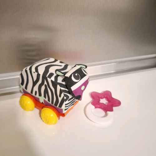 Luna fabric animal with wheels and teether star like new