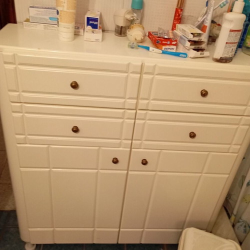 White cabinet with four drawers used