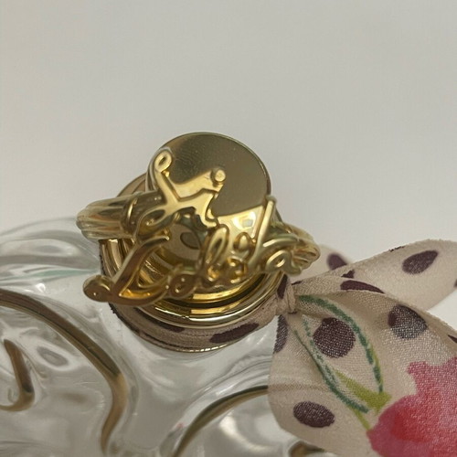Sí Lolita Lolita Lempicka empty perfume bottle used, lucky four-leaf clover
