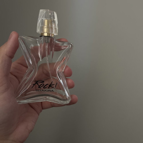 Rock! by Shakira perfume bottle used, empty, star-shaped