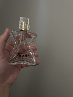 Rock! by Shakira perfume bottle used, empty, star-shaped