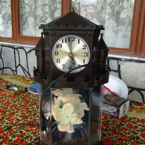 Table clock used collectible with lighting and rotating flower