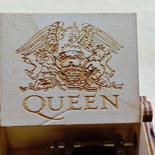 Wooden Queen Music Box like new with hand crank and engraved design