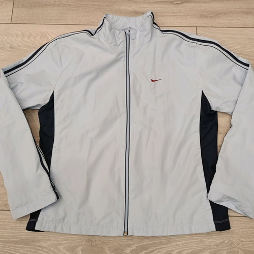 Vintage Nike windbreaker jacket used in ice blue with dark navy details
