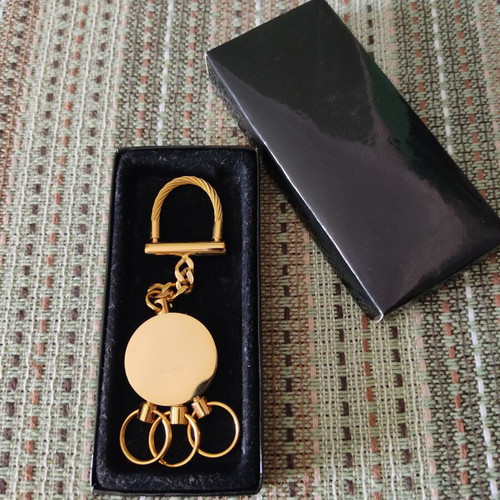 Deluxe keychain with case, like new, gold tone