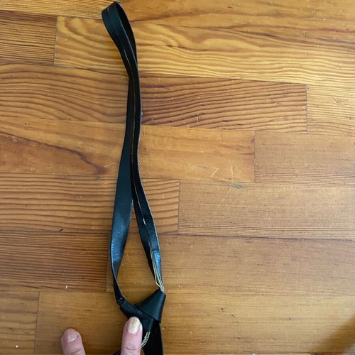 Leather thin black tie vintage used with fading marks