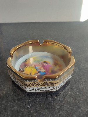 Vintage porcelain ashtray with religious scene used, gold details