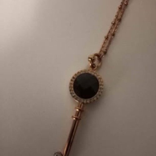 Folli Follie key necklace with long chain and authentic zircon