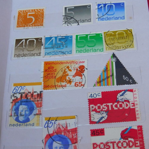 Red album with worldwide collectible stamps