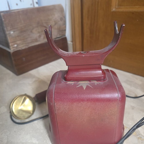 Metal telephone used, red, wired connection