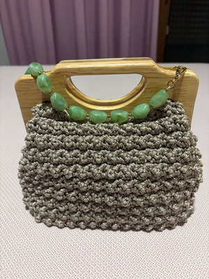 Handmade knitted beige bag with wooden magnetic clasp and beaded handle