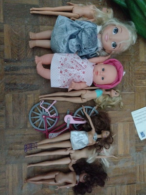 Dolls like new, set of 7 with bicycle