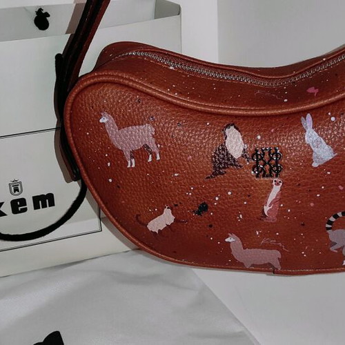Kem crossbody bag brown new with animal designs and zipper