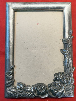 Romantic vintage metal frame with carved roses used