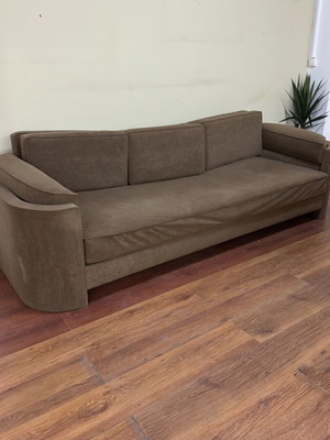 Modern three-seater sofa used, light brown color