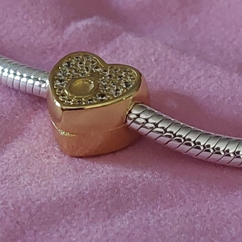 Charm stopper heart new, gold color with white zirconia and Pandora logo