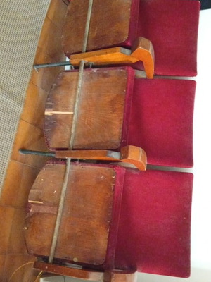 Vintage cinema seats used, one leg missing