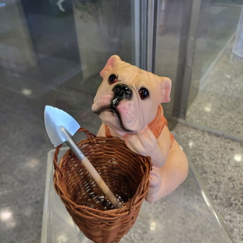 Decorative dog figure with basket