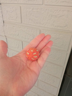 Small orange ball used with design