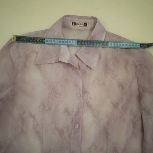 Sheer blouse in soft purple with abstract designs, like new, size M
