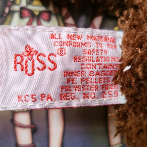 Russ kisses stuffed monkey used brown with heart