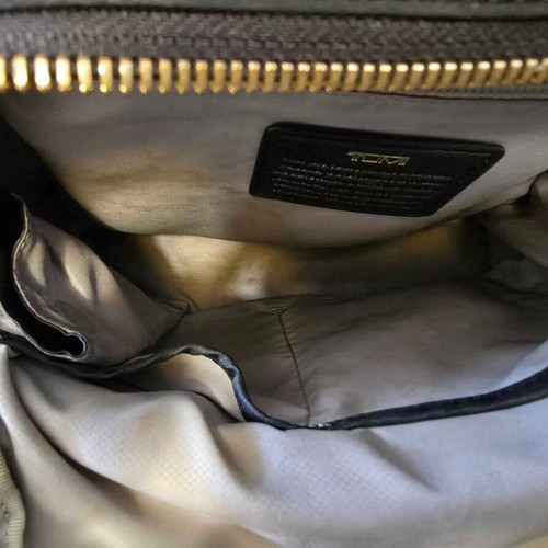 Tumi backpack used, black with gold details