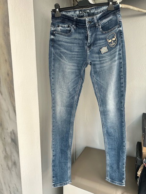 Only skinny jeans with various designs and studs like new, size 28/34