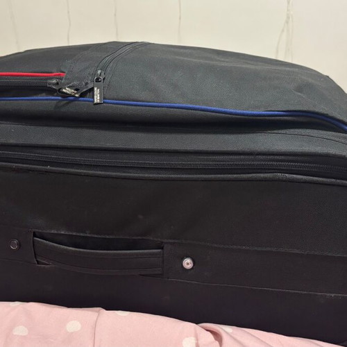 Benetton fabric black suitcase used with two wheels