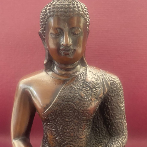 Thai Buddha statue with detailed embossed decoration
