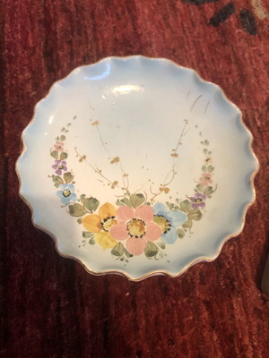 Vintage ceramic plate hand-painted with floral design used