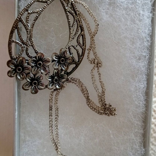 Chain with large motif used, silver with floral decoration
