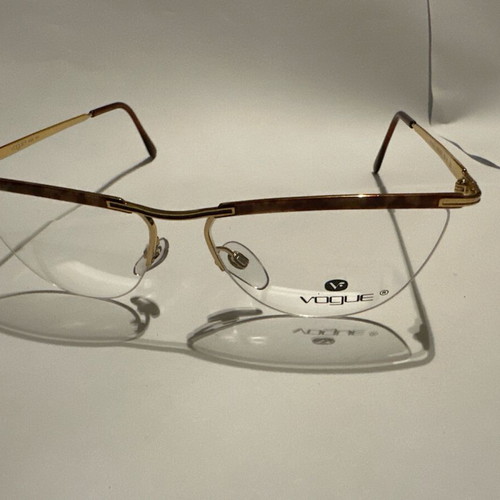 Oval Vogue optical glasses with tortoise details and gold frame, new