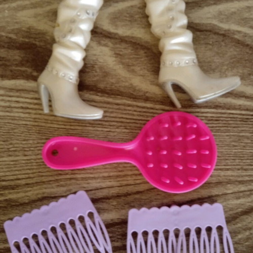 Barbie boots and combs used