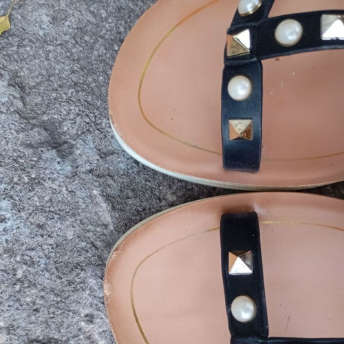 Brilliant black flat sandals with studs and pearls