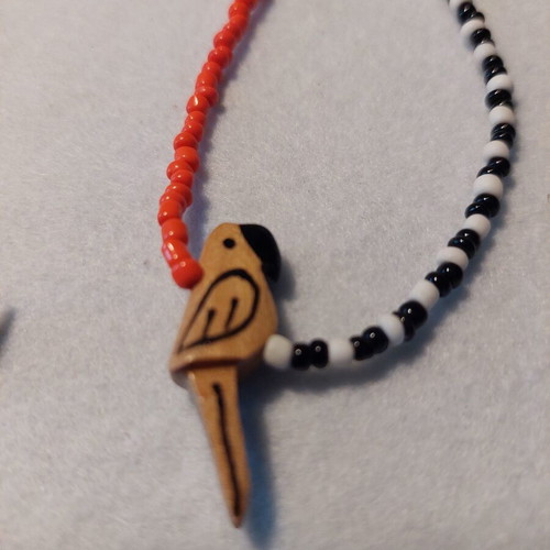Parrot Necklace new, bright orange and black-white colors