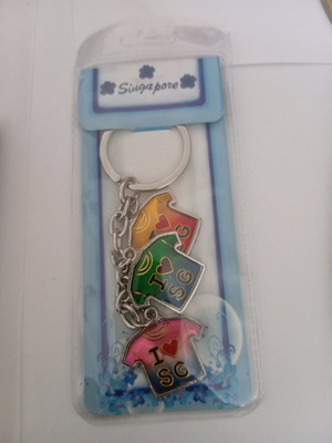 Keychain souvenir new from Singapore with three shirt-shaped charms