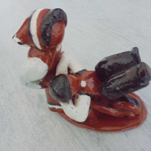 Ceramic figure used, retro genre scene woman pushing man in cart