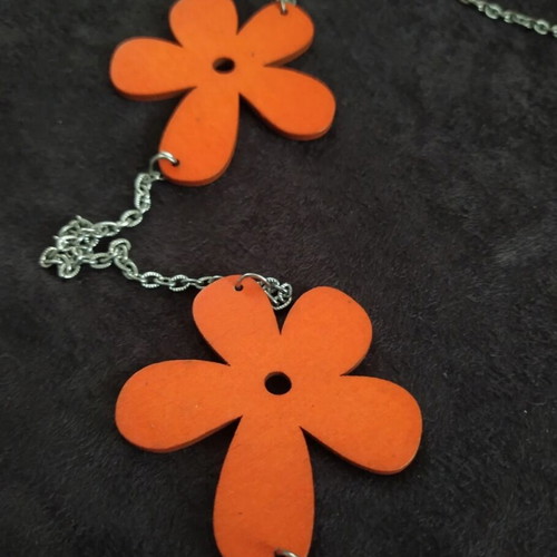 Long necklace with orange wooden daisies and silver chain like new