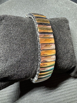 Elastic steel bracelet like new, silver and gold tone