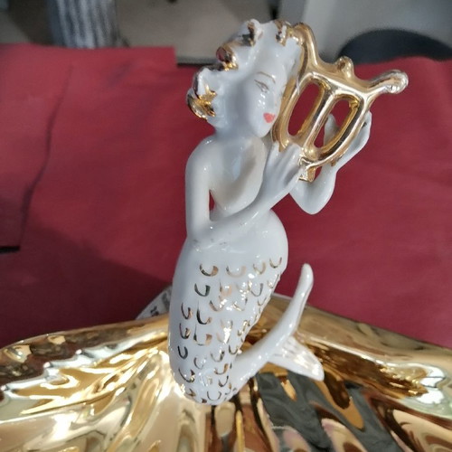Mermaid and clam used, gold and porcelain decoration