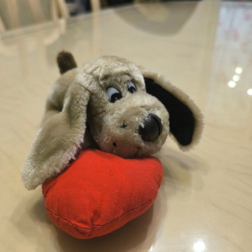 Plush dog with red heart like new