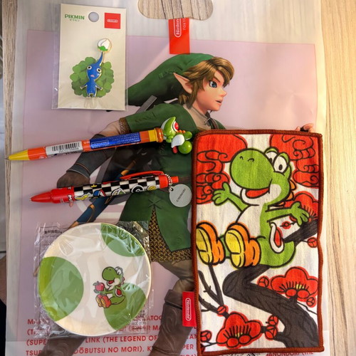 Nintendo Store Pikmin pin, Yoshi plate, pens, towel, Zelda bag