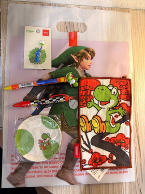 Nintendo Store Pikmin pin, Yoshi plate, pens, towel, Zelda bag
