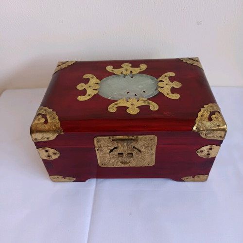 Wooden jewelry box used with brass decorative elements