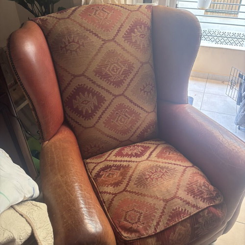Kourtis armchair used with leather arms in brown tones