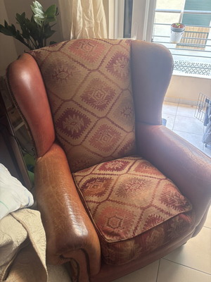 Kourtis armchair used with leather arms in brown tones