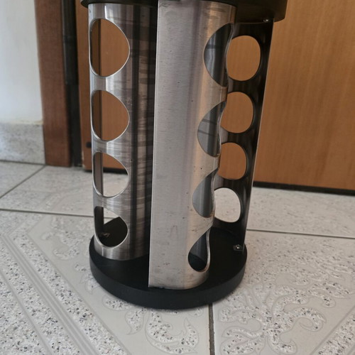 Rotating spice rack with 16 slots for round jars