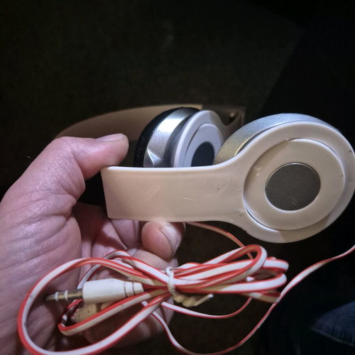 Foldable on-ear headphones used, white with silver details