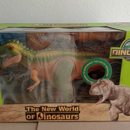 Dinosaur toy like new, in original box with minor wear