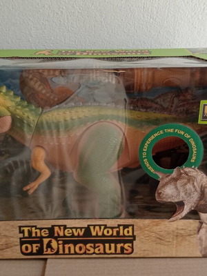 Dinosaur toy like new, in original box with minor wear